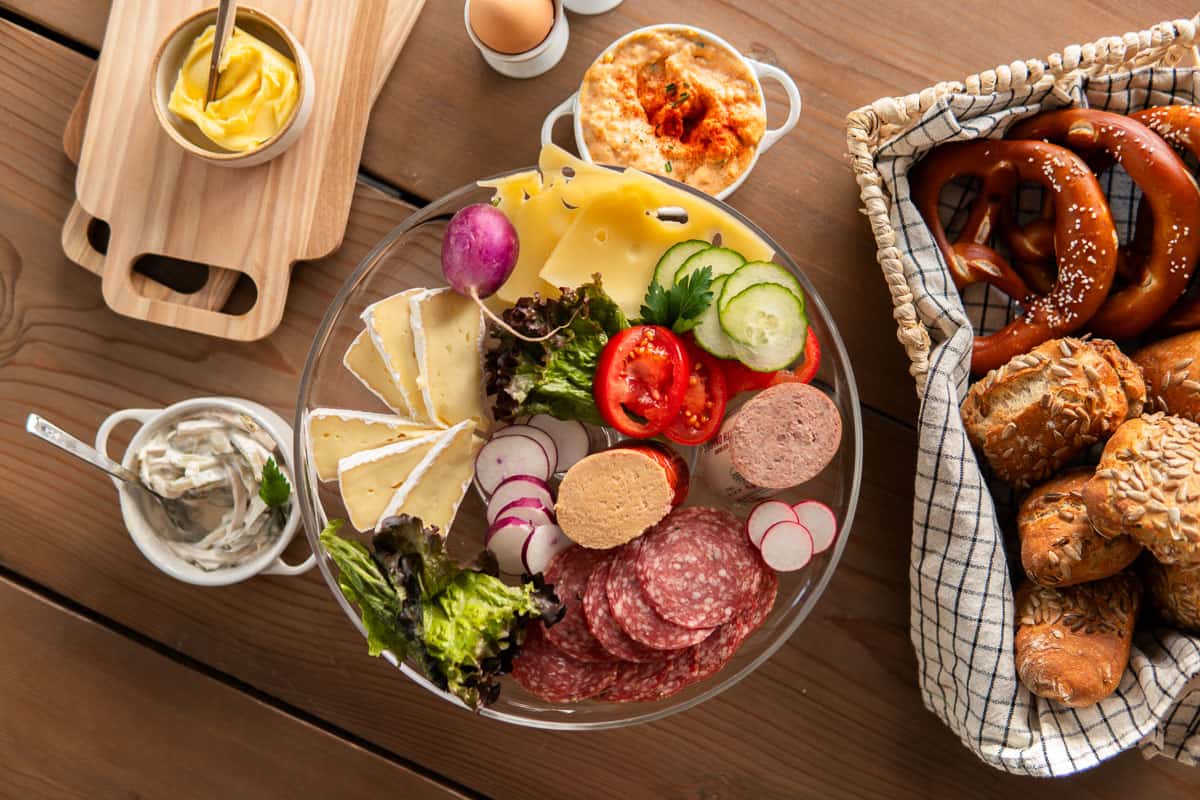 German breakfast with brotchen, meats and cheeses and eggs