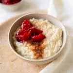 Easy rice pudding topped with stewed plums.