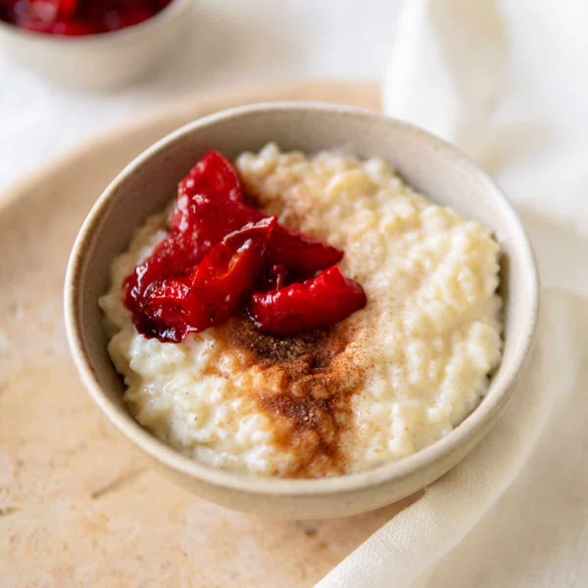 Easy rice pudding topped with stewed plums.