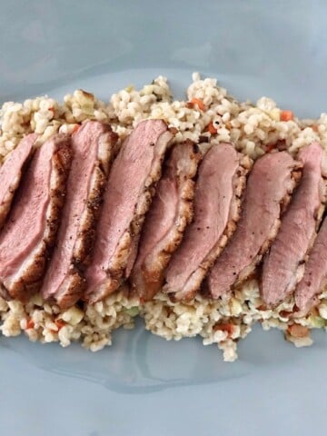 German smoked duck breast with root vegetables and barley.