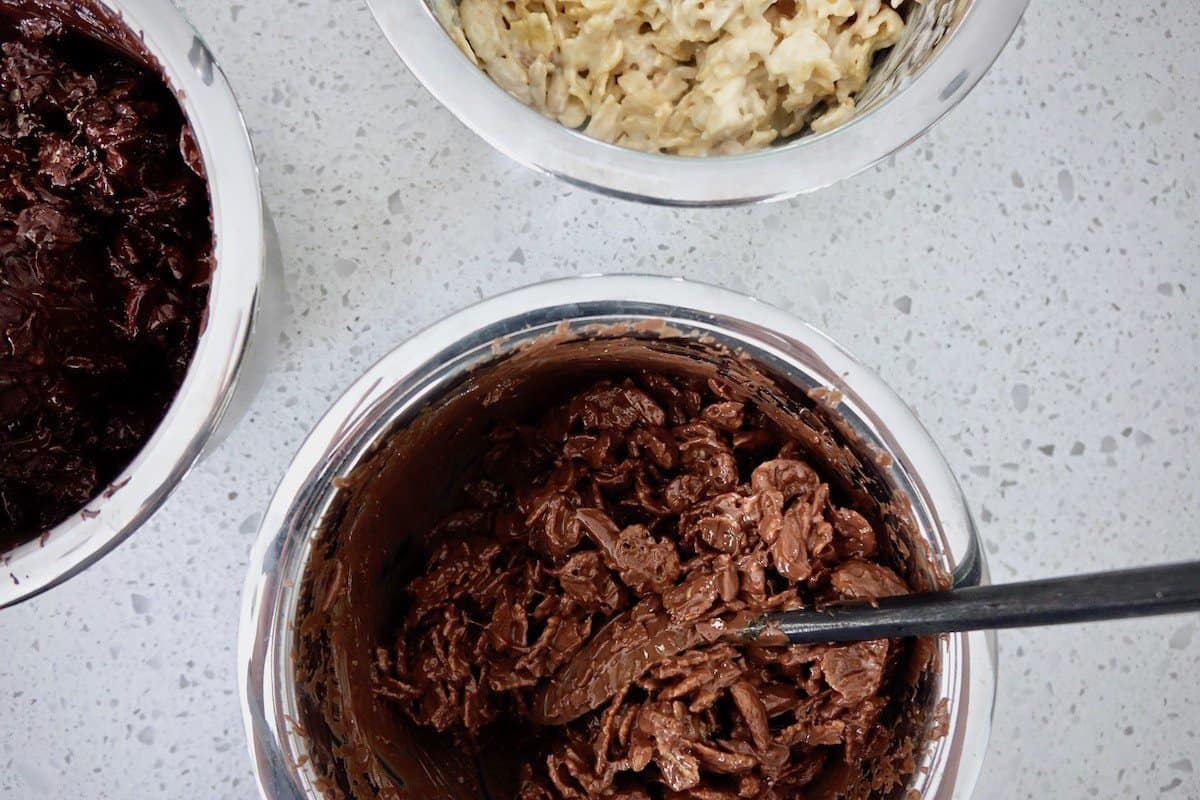 Mixing the cornflakes, chocolate and almonds for Schokocrossies