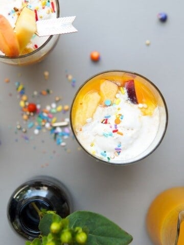 top view of 2 punch glasses and fresh fruit