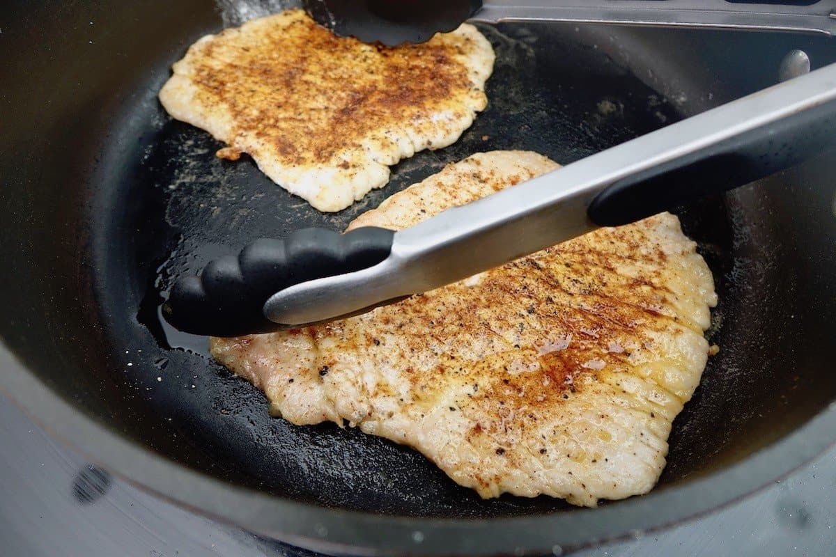 searing the pork schnitzel