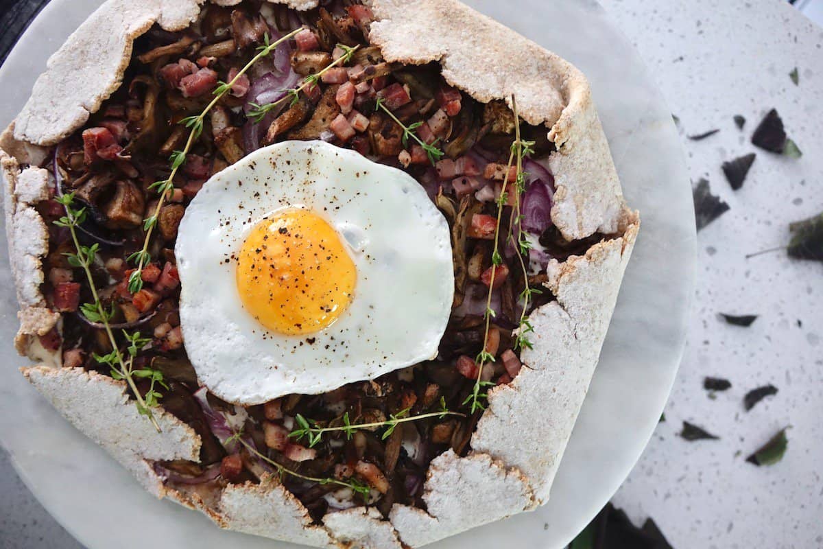 breakfast flatbread topped with a fried egg