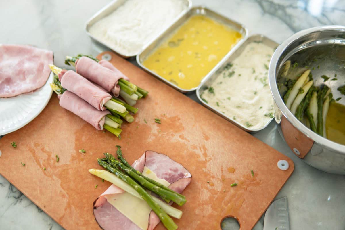 Showing how to wrap asparagus for cordon bleu and how to bread it.