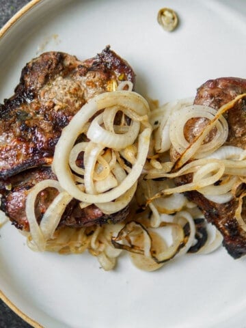 grilled schwenkbraten on a white plate