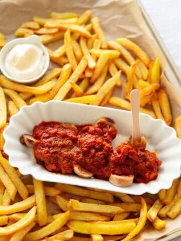 A currywurst with fries.