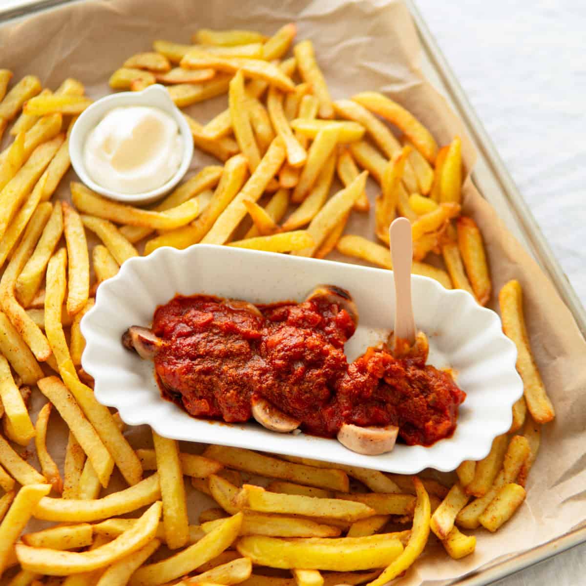 A currywurst with fries.