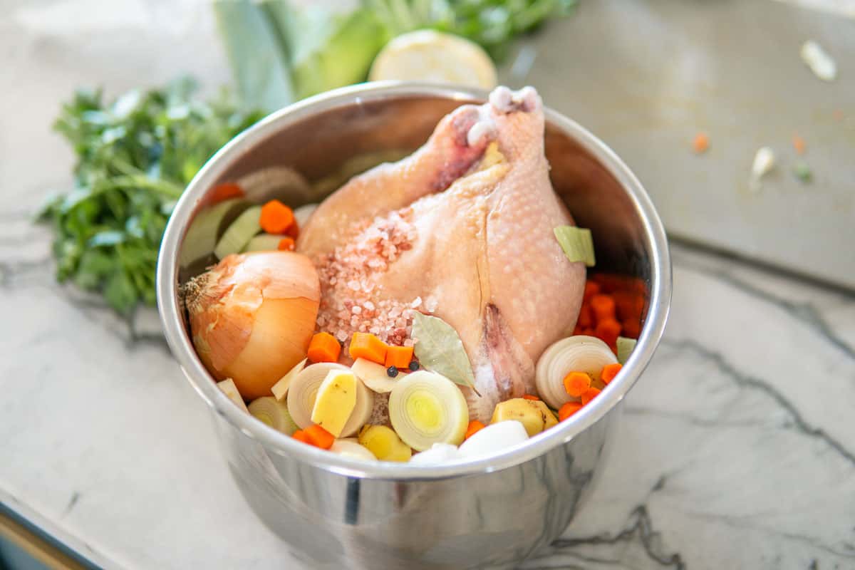 chicken and vegetables ready to be cooked for soup