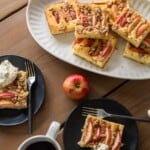 slices of apple cake on platter and plates