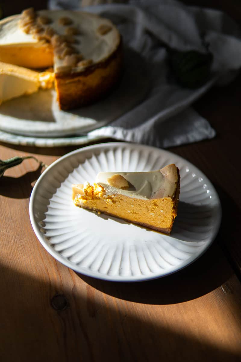 slice of pumpkin käsekuchen sitting on a plate