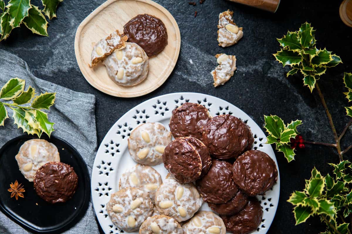 platters and plates with sugar- and chocolate-glazed gingerbread cookies
