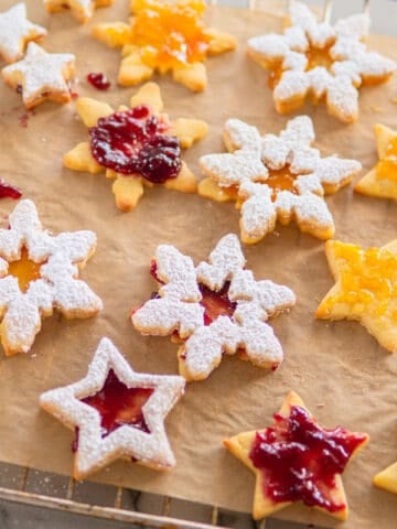 a baking sheet filled with Spitzbuben German christmas cookies