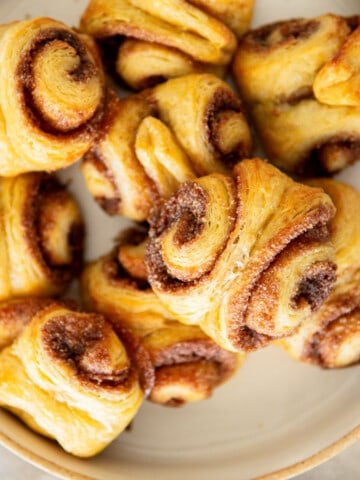 closeup of franzbrötchen stacked on a plate