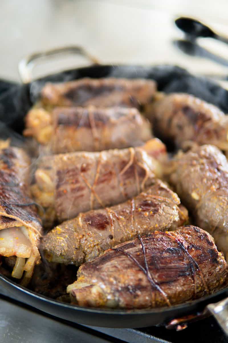 searing beef rouladen in a pan