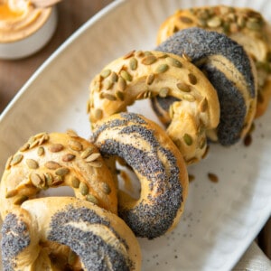 bagels arranged on a white platter