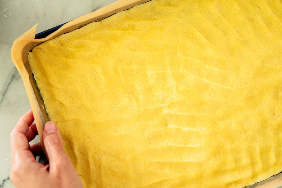 pressing down the cookie bottom using fingers