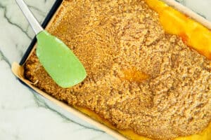 spreading on the nut layer using a rubber spatula