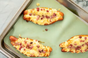 bacon cheese pretzel sticks on a baking sheet