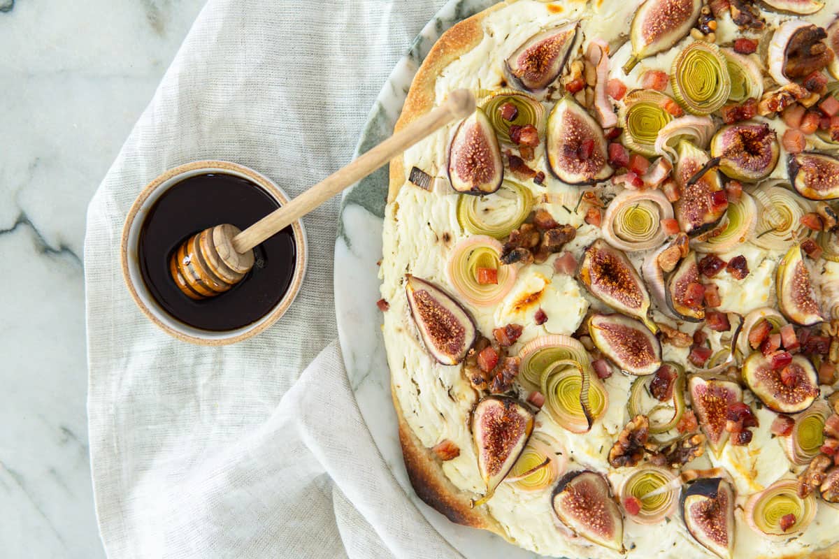 closeup of honey and fall flammkuchen