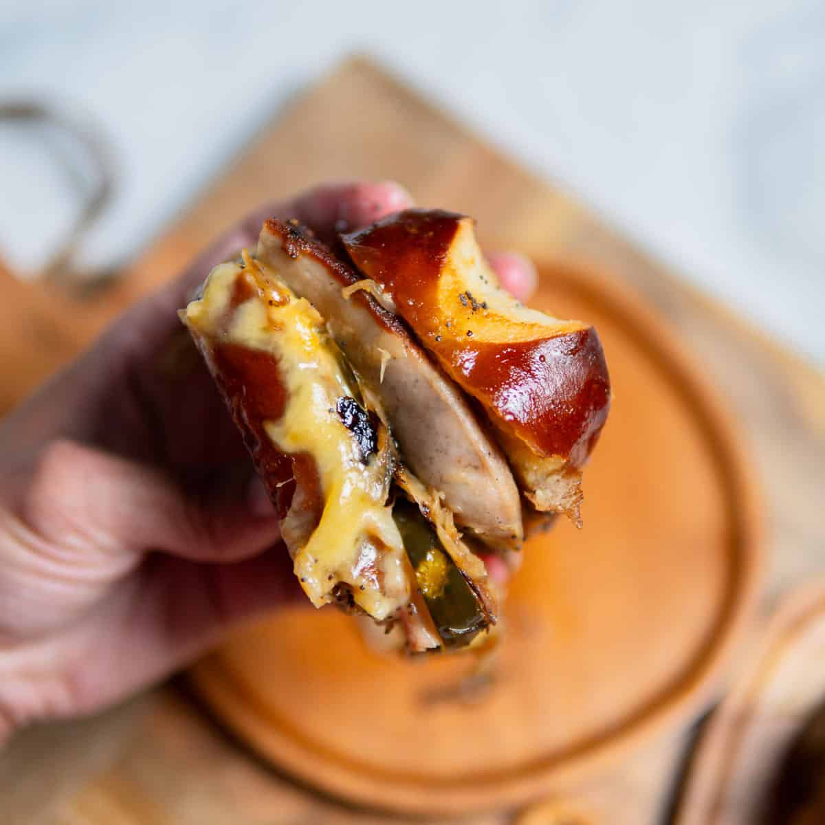 hand holding a German ham and cheese slider