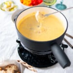 beer cheese fondue in a fondue pot