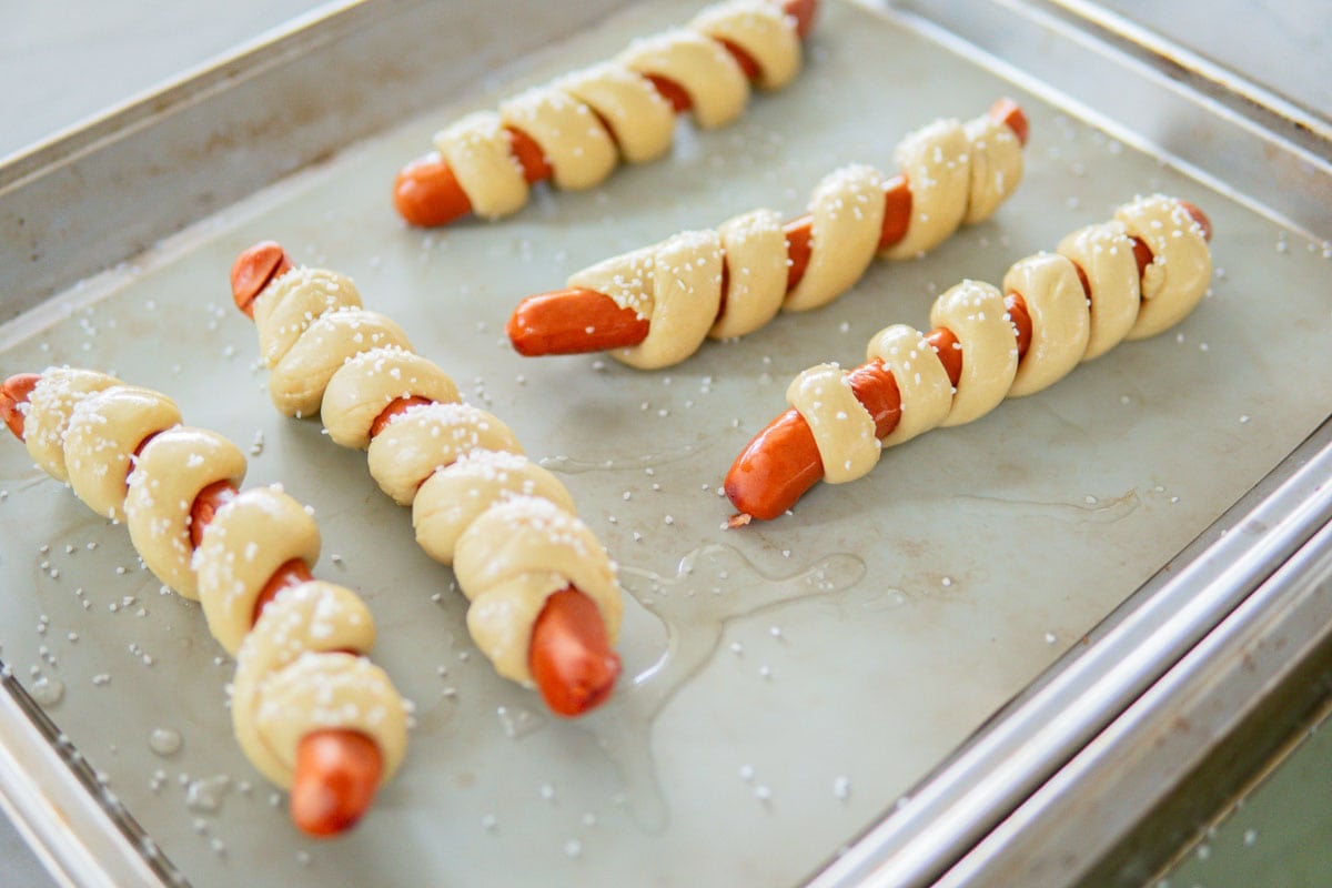 German pretzel dogs before baking