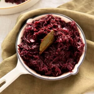 Authentic German red cabbage in a small white skillet.