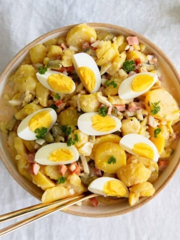 Creamy German potato salad in a white bowl