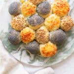 Baked slider buns on a marble platter.