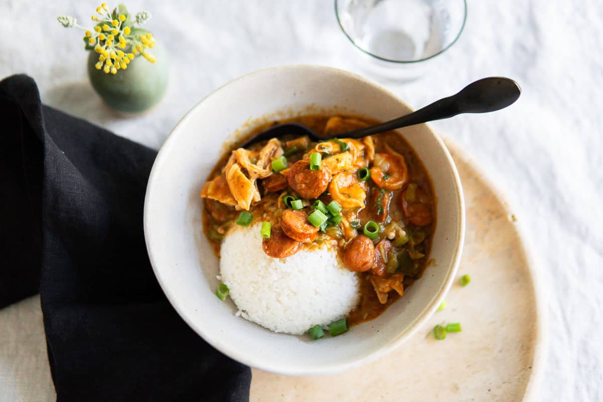 Authentic gumbo served in a bowl with steamed rice.