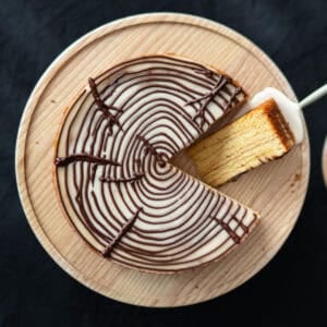Top view of a whole Baumkuchen, with one slice turned on its side, so you can see all of the pretty tree rings.