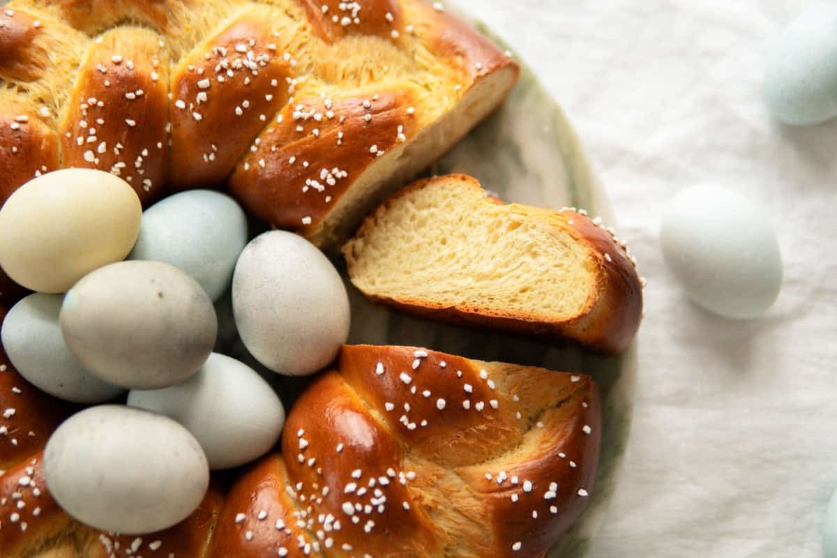 Closeup of German Easter bread showing one slice from the side and the rest of the bread next to it.
