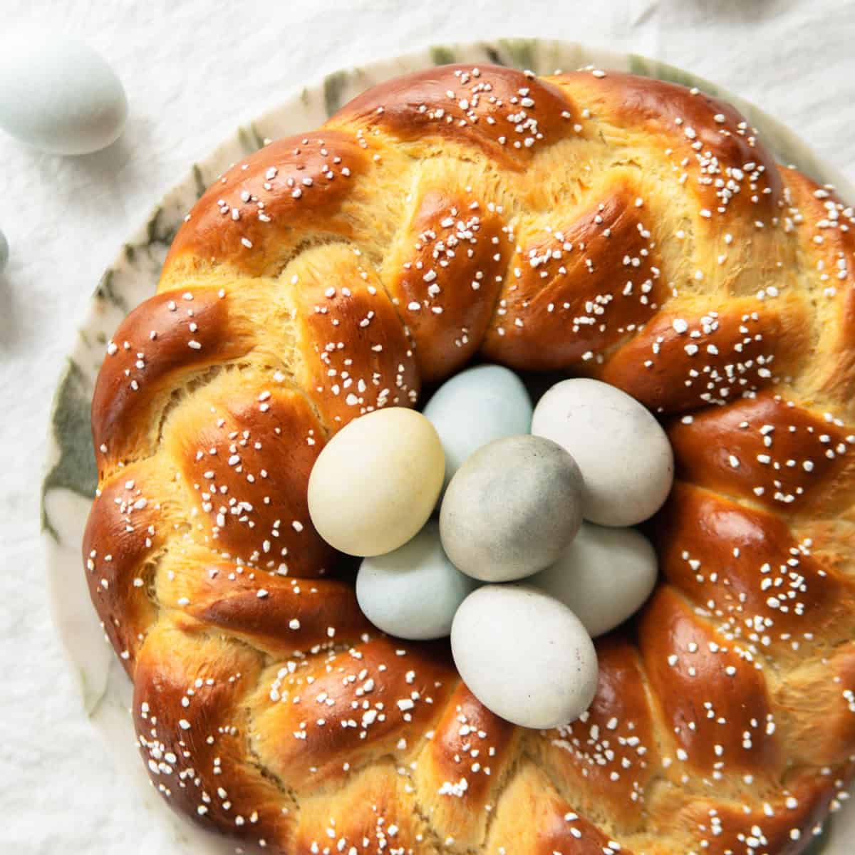 Top view of a German Easter bread filled with dyed eggs in the middle.