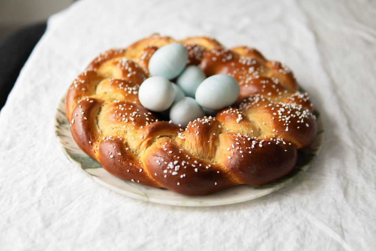 Side view of an Easter bread sitting on a table.