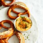 plate with pretzels and Obatzda cheese dip