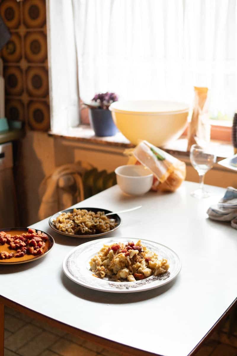 Omas kitchen table with a plate of mini potato dumplings