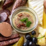 German bacon jam called Griebenschmalz in a ramekin on a German meat and cheese board.