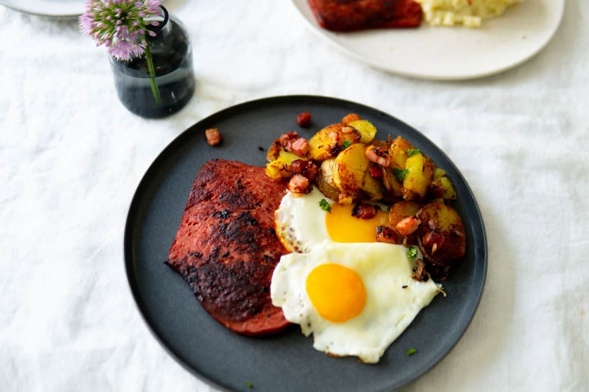 Oma's way to make Fleischkäse with eggs and German pan-fried potatoes.