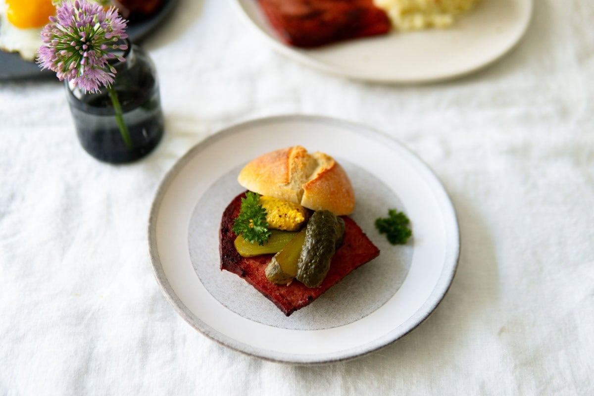 Leberkäse on the go in a Brötchen, a crusty German roll.