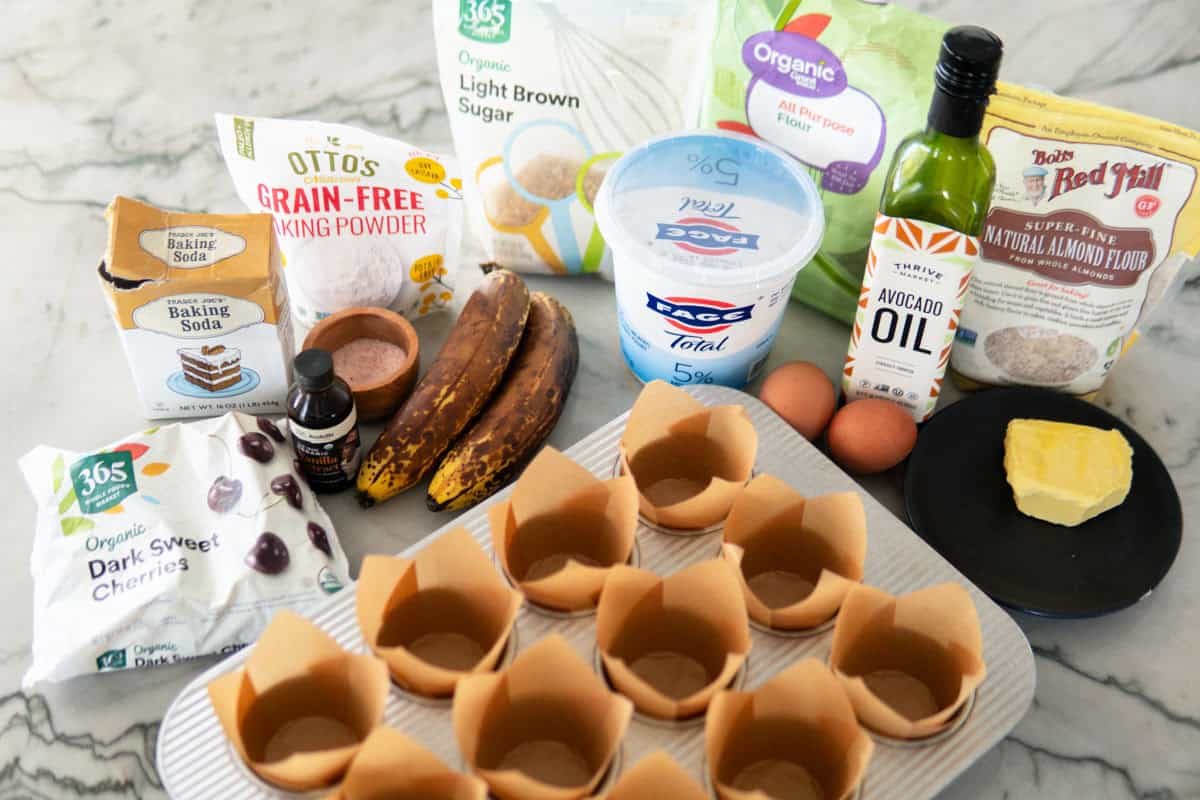 Ingredients for banana muffins with cherries.