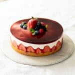 Assembled yogurt berry cake on a cake platter.